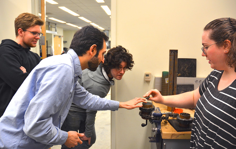 Graduate students working on a project